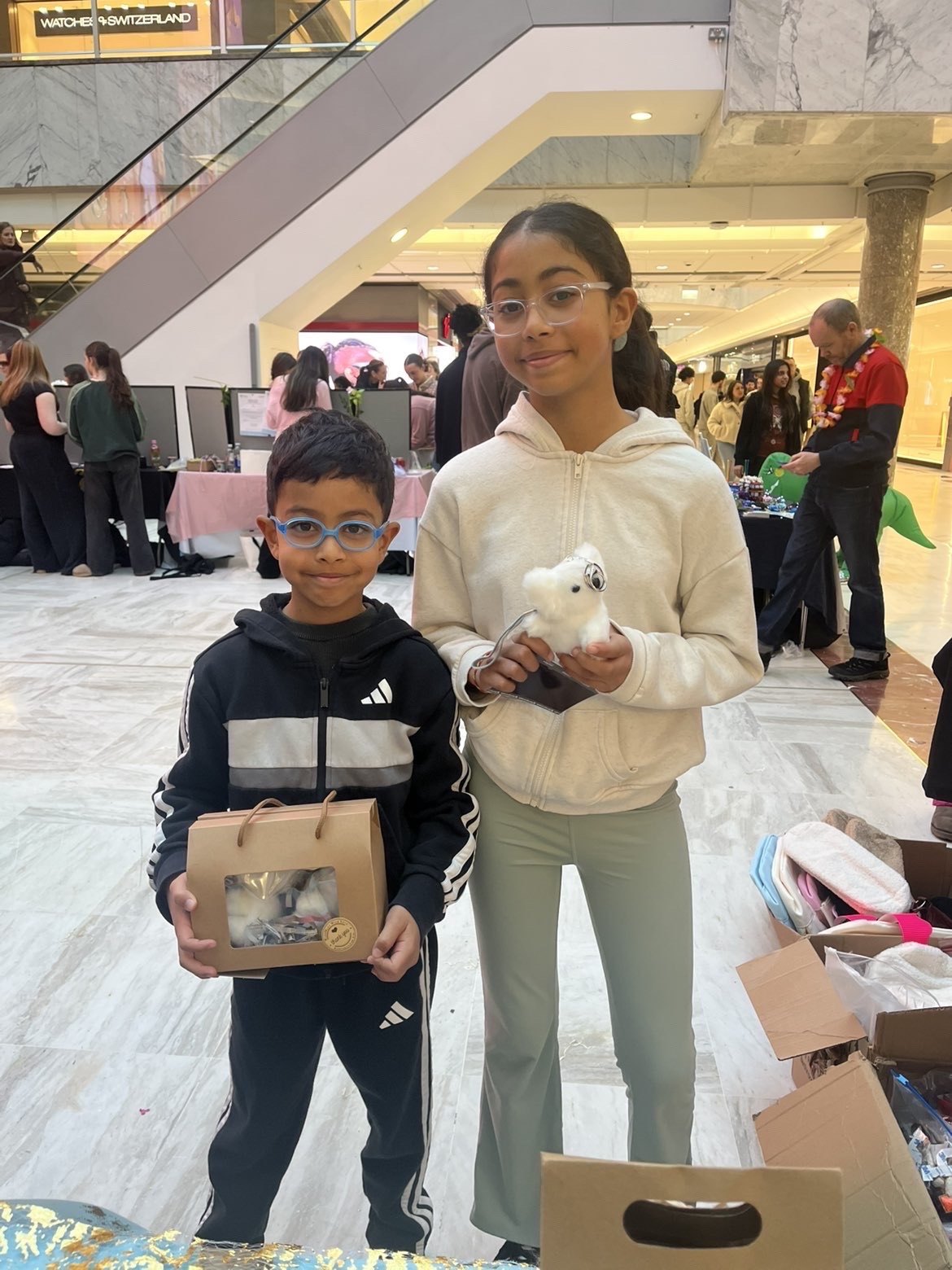 Two young customers holding HaloZen products at Brent Cross